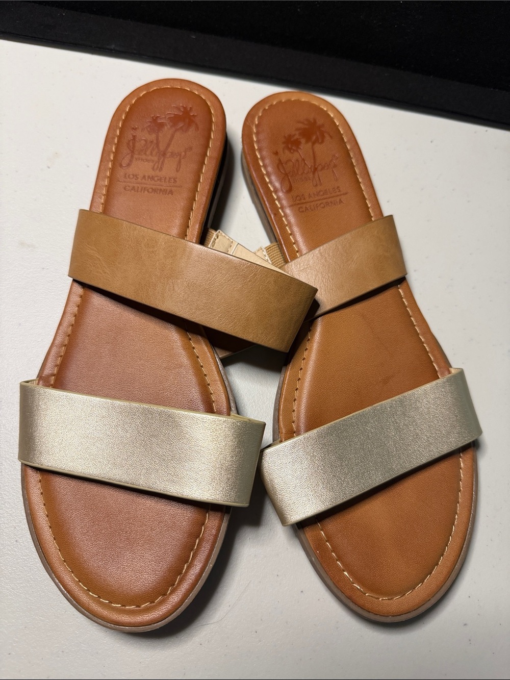 Jellypop Women’s Two-Strip Slide Sandals in Tan and Metallic Gold